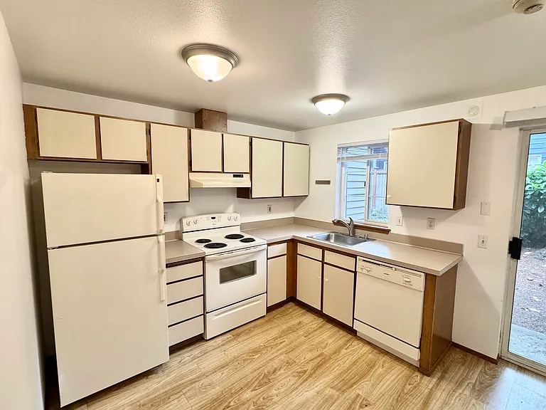 Kitchen with eating area and slider to patio.