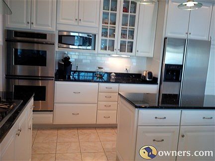 Partial View of KItchen from  Lower Level Stairwell Landing