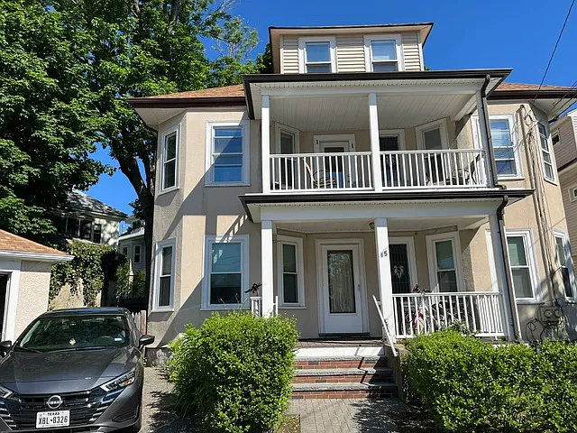 Nice front porch for lounging. There is off street parking for 3 cars...total bonus in this area wiht very limited street parking. One spot is inside a garage.
