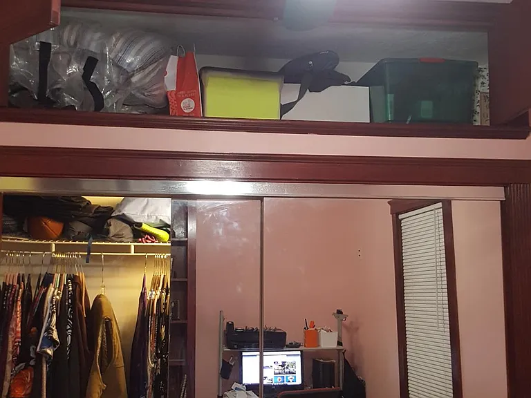 Slinging glass wall to wall closet with deep over head storage