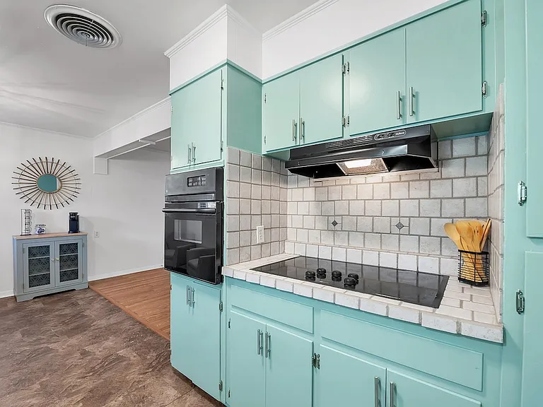 Updated kitchen with full-size appliances and stocked cooking essentials.