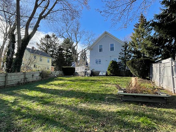 Large backyard, view of back of house