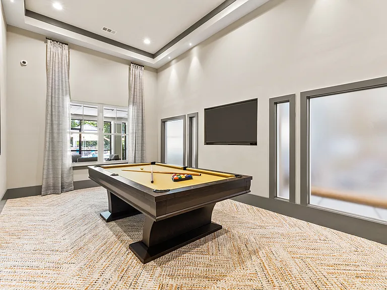 Langley Pointe Apartments | Billiards Room w/ View of the Pool
