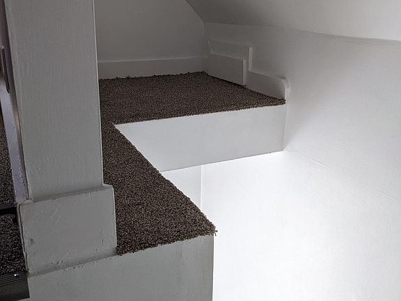 Storage area above the stairs