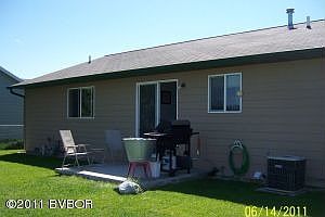 Back of house with patio