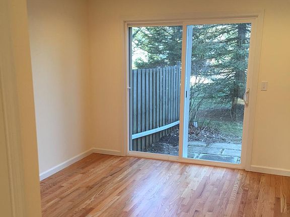 Dining area with new sliding door that opens to small patio