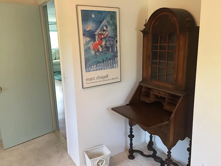 Your small desk next to your standard folding-doors closet