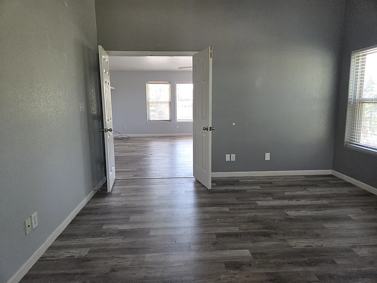 Another view from the master bedroom looking out to the living room through the double doors.