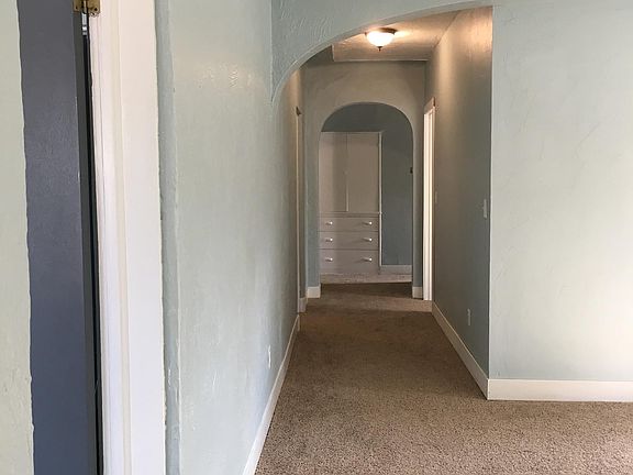 Hallway to kitchen and bathroom and two other bathrooms