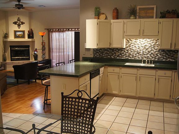 Dining room looking toward kitchen and living area. Walk out to covered back patio.