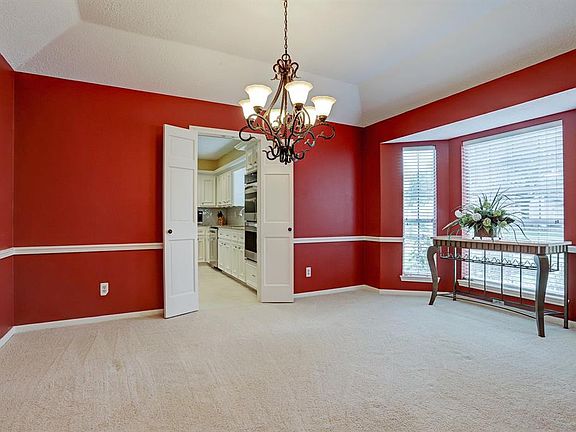 Spacious dining room with bay window has plenty of room to seat all of your guests.