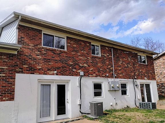 REAR OF THE HOUSE. LEFT SIDE IS THE 216 PATIO.