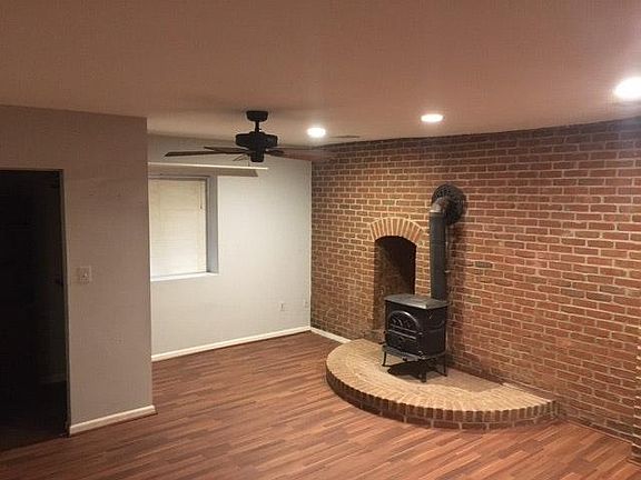 Bedroom w wood burning stove - firewood onsite (window faces