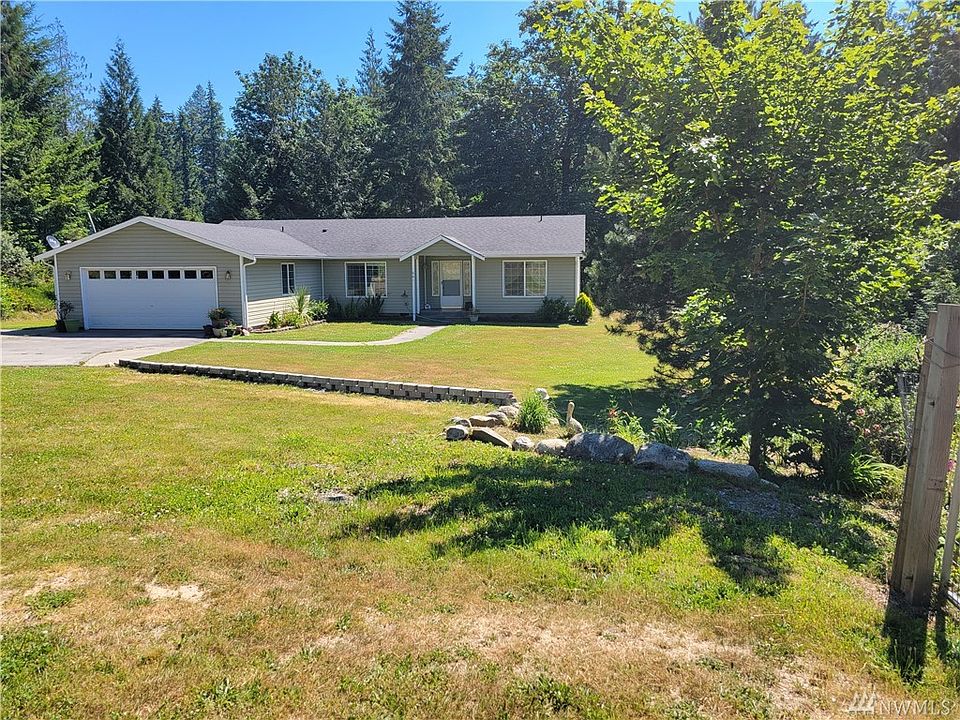 This beautiful home has had one owner and has been meticulously maintained. Off of Grapeview loop South it is surrounded by 5.1 acres and is FULLY FENCED. 
