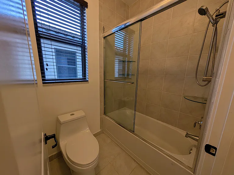 Shared secondary bathroom toilet and shower