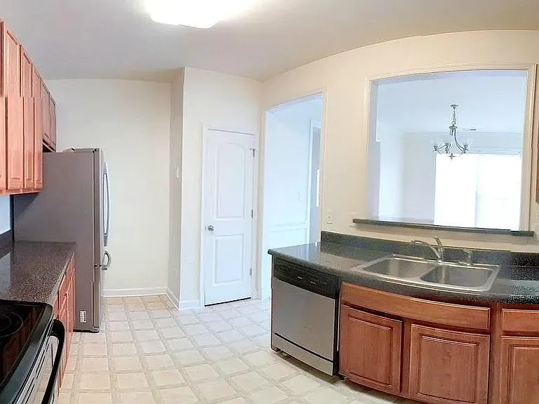 Kitchen open to the Dining Room - Stainless Steel Dishwasher, Microwave, Oven with Ceramic Cooktop and Refrigerator