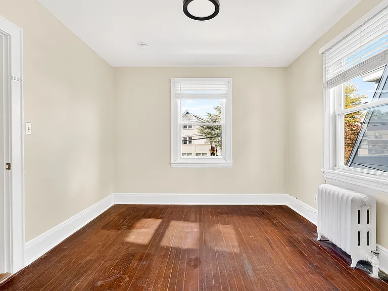Bedroom with hardwood floors.