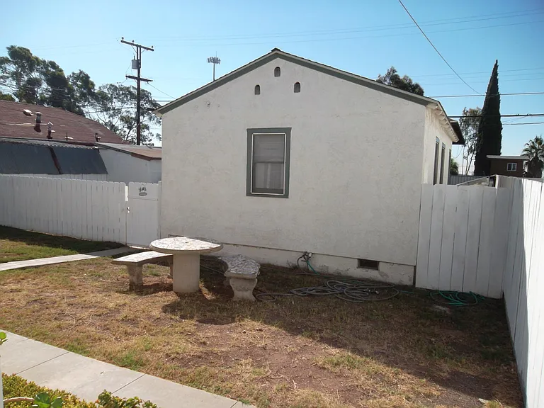 Side yard between the main house and the cottage