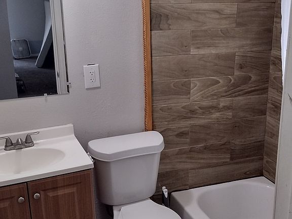 Upstairs bathroom with tub