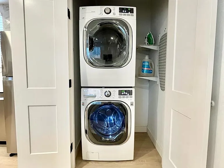 Invisible chores: A closed door reveals the convenience of an in-unit washer and dryer.