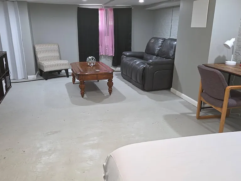 Flexible common area with seating, coffee table, and a work deskideal for relaxing, studying, or entertaining.