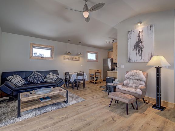 Living Room. Leather couch folds out into full-size sleeper.