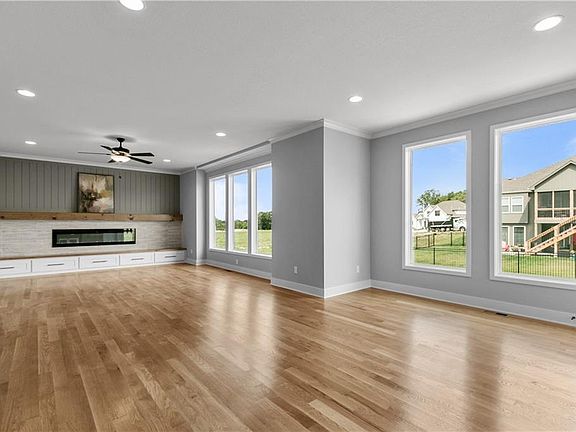 The foyer leads straight back to the heart of the home the open living dining rooms and kitchen.
