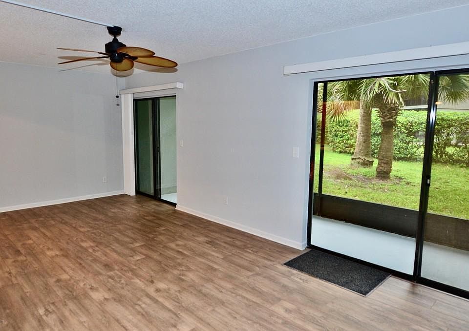 Sliding Glass Doors leading to outside Patio and View.
