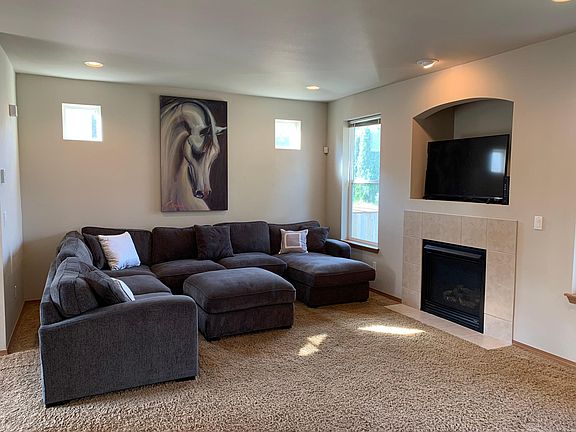 Oversize living room with gas fireplace.