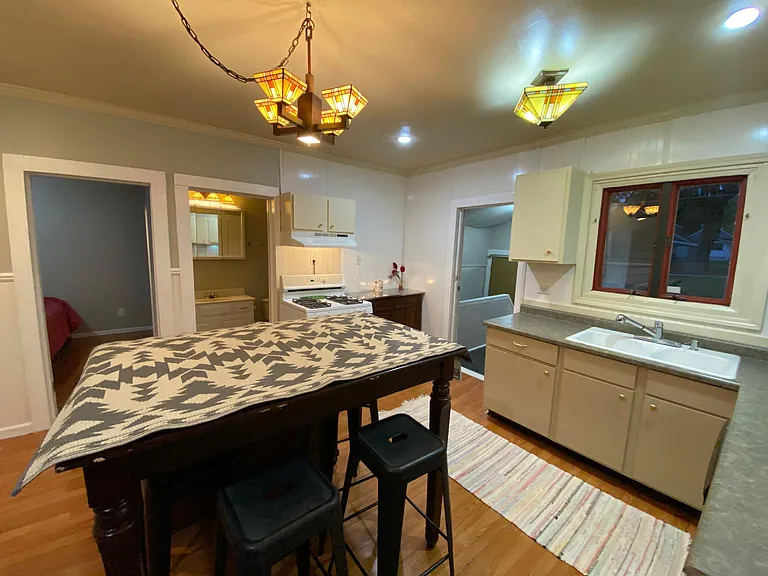 The kitchen interior back door leads to the mudroom and the basement or exterior backdoor.