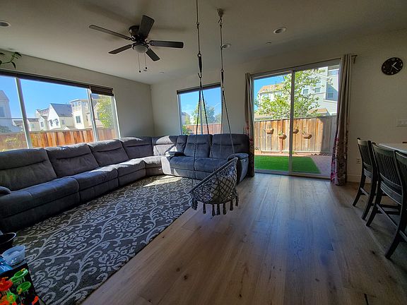 Living Room with high ceiling, backyard access.