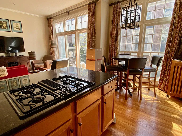 Kitchen, table space, living area and balcony