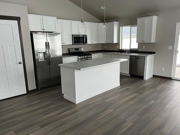 Open concept kitchen with pantry storage