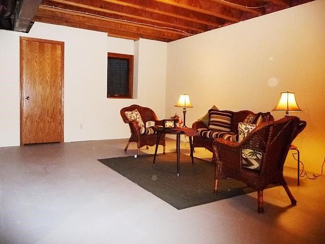 The lower level is sheet rocked but would still need a ceiling if desired, has an egress window so could be a third bedroom too.