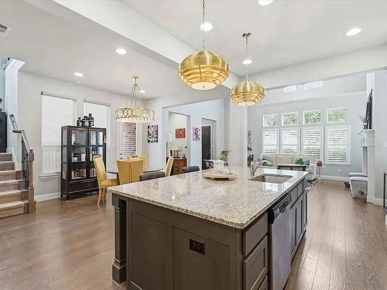 A gourmet chef's kitchen featuring an expansive central island optimized for daily meal prep or effortless entertaining.