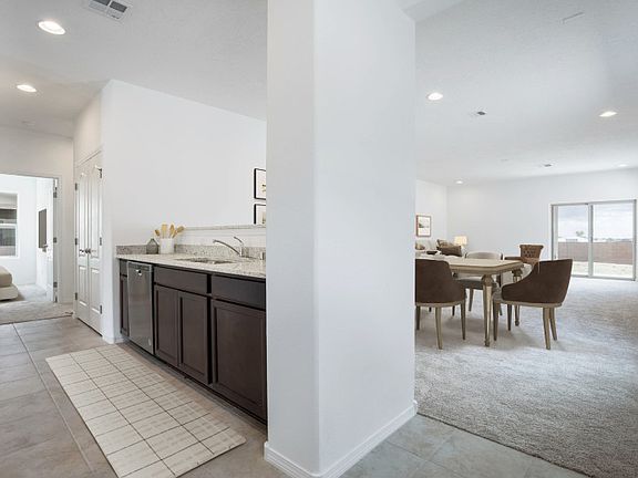 Connected to the living room is the spacious kitchen.