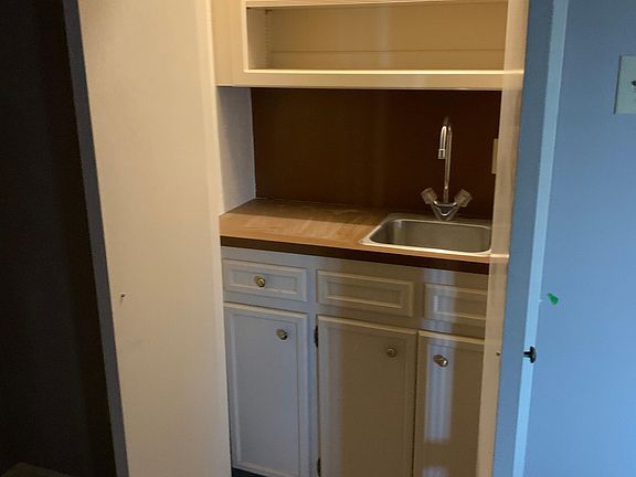 Wet bar located in dining room.