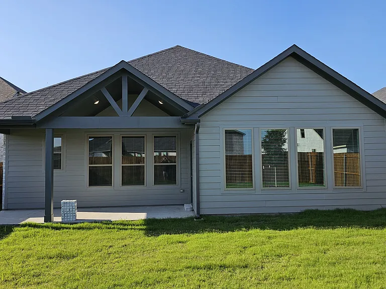A large, private backyard with plenty of room for outdoor activities