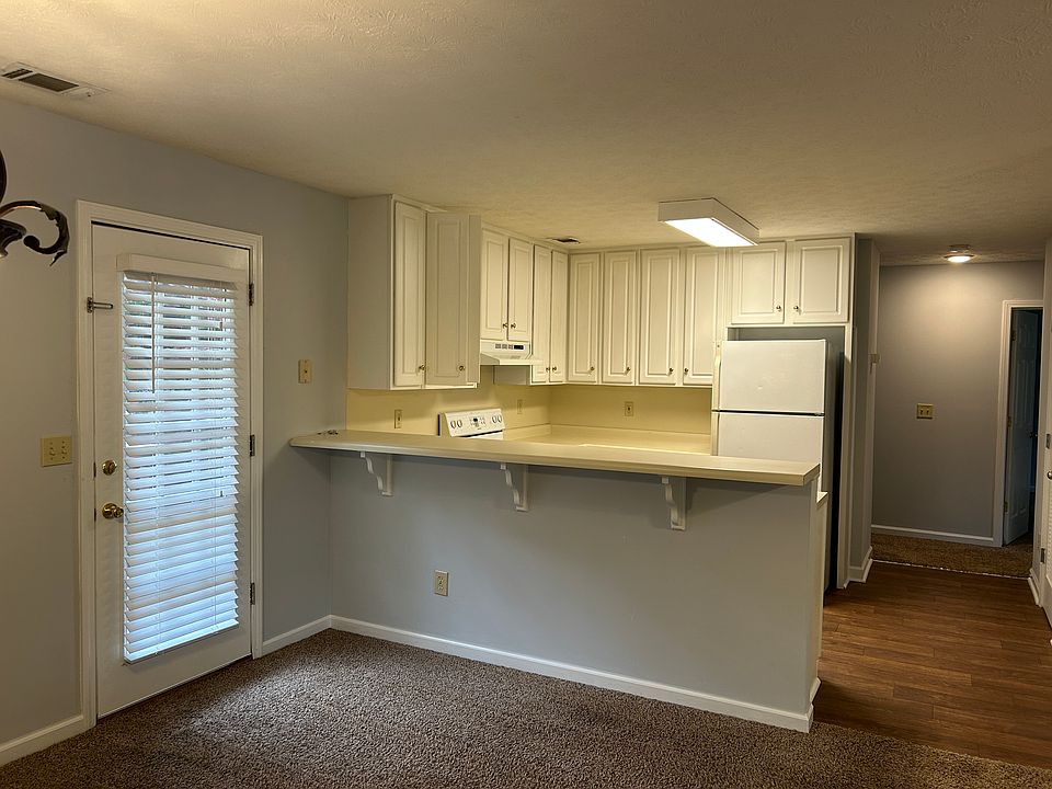 Dining/kitchen looking into the hallway