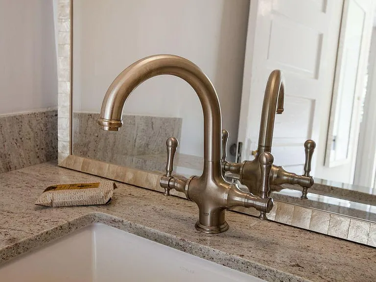 New Stone Vanity and Nickel Faucet