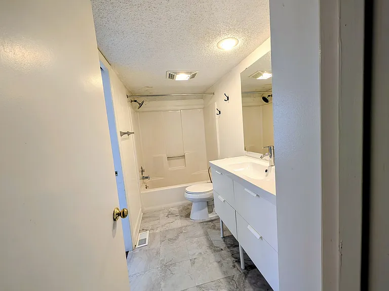Attached bathroom to bedroom has 2 doors