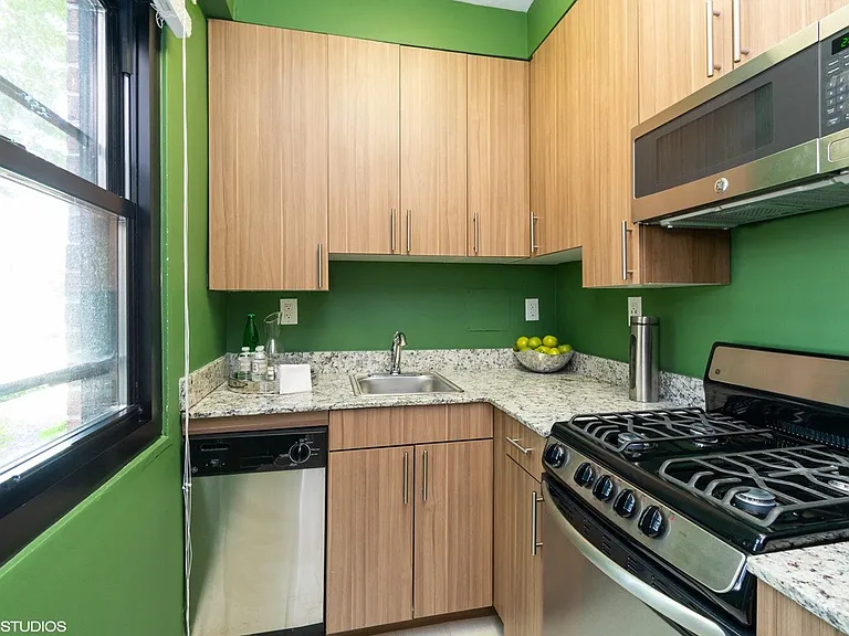 Studio model kitchen with updated wooden cabinets