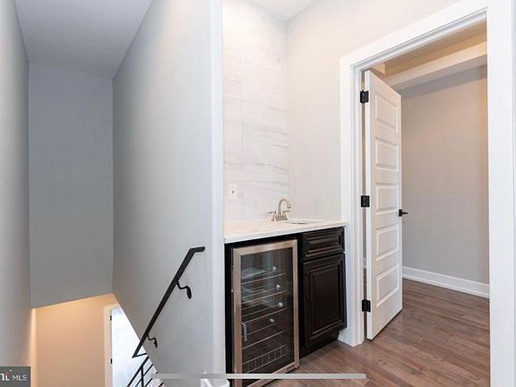 3rd floor wet bar that services our roof deck (roof deck is not pictured but includes speaker setup, built in lighting, flooring and a pergola which will remain for tenant use!)