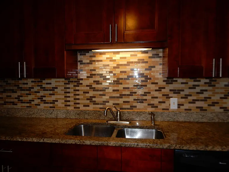 Glass Back splash and granite counters in kitchen