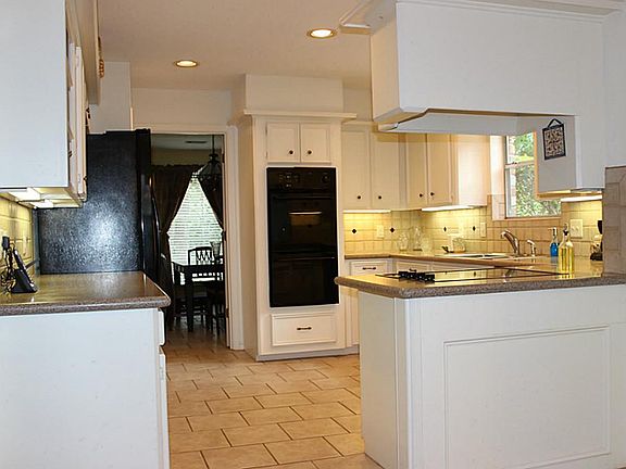 View of the new double ovens and upgraded recessed lighting.