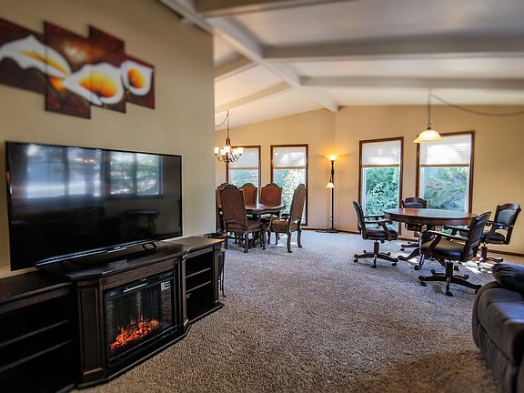 This area has an HD TV, game table that converts to a poker