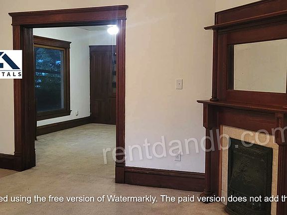 Living room with decorative fireplace