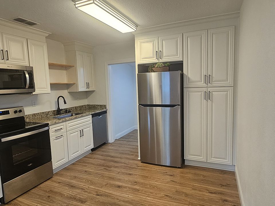 Eat-in kitchen with stainless steel appliances, granite counters, built-in floor to ceiling pantry, upgraded soft-close cabinetry, and bronze hardware
11.5x12