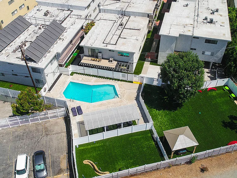 Aerial drone image of pool, pet play park, and community park at Cedar Glen.