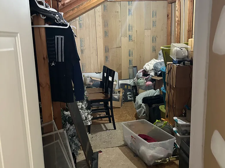 Unfinished area of the loft for storage